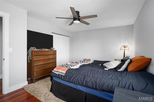 719 Green Ridge Dr, Catawissa, MO 63015 - bedroom with wood finished floors, a closet, baseboards, and a ceiling fan