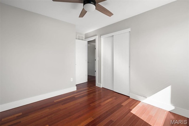 719 Green Ridge Dr, Catawissa, MO 63015 - unfurnished bedroom featuring wood finished floors, a closet, baseboards, and a ceiling fan