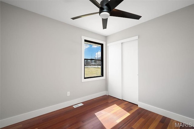 719 Green Ridge Dr, Catawissa, MO 63015 - unfurnished bedroom featuring baseboards, a closet, wood-type flooring, and ceiling fan