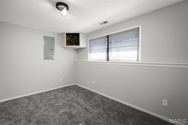 719 Green Ridge Dr, Catawissa, MO 63015 - empty room featuring electric panel, dark colored carpet, and baseboards