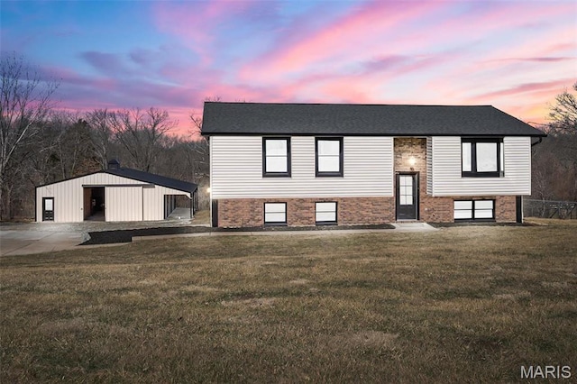 719 Green Ridge Dr, Catawissa, MO 63015 - split foyer home featuring an outdoor structure, a front yard, and brick siding
