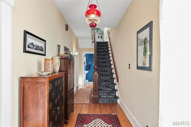 18 Georgia Ave, Saint Louis, MO 63135 - corridor with stairs, wood finished floors, and baseboards