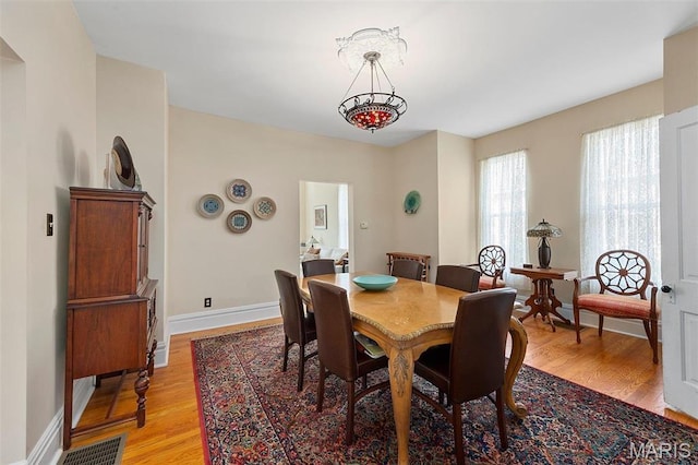 18 Georgia Ave, Saint Louis, MO 63135 - dining area with light wood-style flooring and baseboards