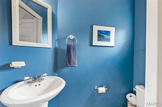 18 Georgia Ave, Saint Louis, MO 63135 - half bath featuring a sink and toilet