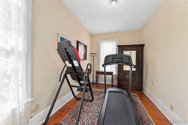 18 Georgia Ave, Saint Louis, MO 63135 - exercise room featuring baseboards and dark wood-type flooring