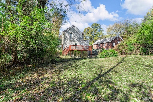 18 Georgia Ave, Saint Louis, MO 63135 - view of green lawn featuring a deck, stairs, and an outdoor structure