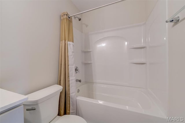 bathroom with toilet, vanity, and shower / bath combo with shower curtain
