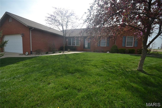 ranch-style home with brick siding, a garage, and a front yard
