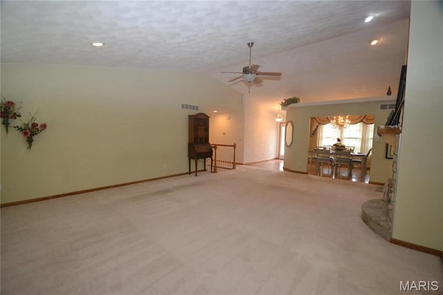 unfurnished living room with vaulted ceiling, a chandelier, ceiling fan, carpet flooring, and baseboards