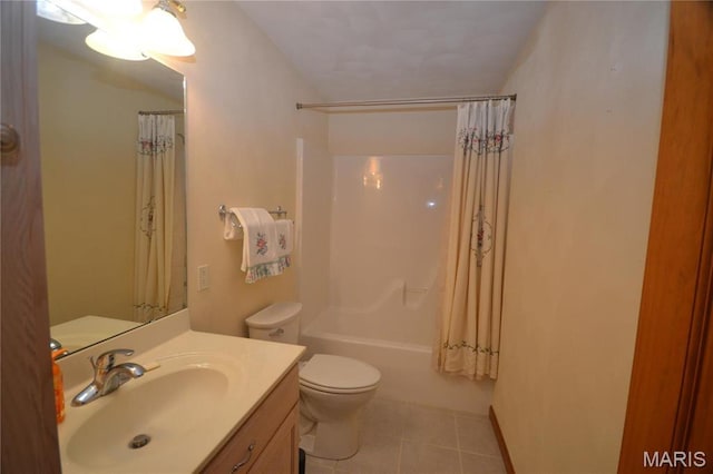 full bath with vanity, tile patterned floors, toilet, and shower / bath combo