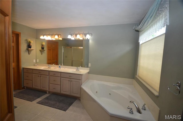 bathroom with a stall shower, a jetted tub, double vanity, and tile patterned floors