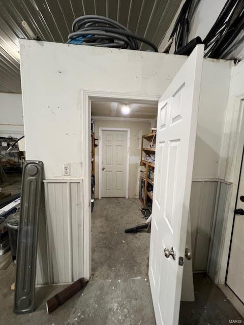 22585 Harlan Ln, Saint Robert, MO 65584 - corridor featuring unfinished concrete flooring