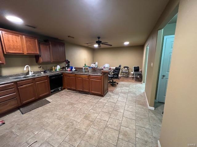 22585 Harlan Ln, Saint Robert, MO 65584 - kitchen featuring a sink, dishwasher, a ceiling fan, dark countertops, and a peninsula