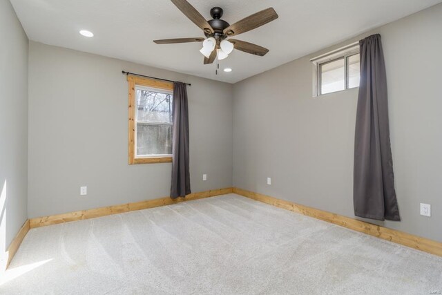 spare room featuring a ceiling fan, carpet floors, healthy amount of natural light, baseboards, and recessed lighting