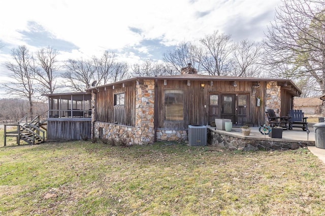 64 Trails End Ln, Doniphan, MO 63935 - rear view of property featuring a sunroom, stone siding, a chimney, and a patio area