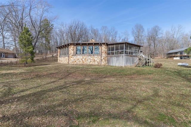 64 Trails End Ln, Doniphan, MO 63935 - view of side of property with a sunroom, stone siding, stairs, a yard, and a chimney