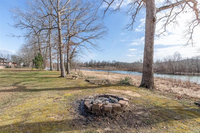 64 Trails End Ln, Doniphan, MO 63935 - view of grassy yard with an outdoor fire pit and a water view