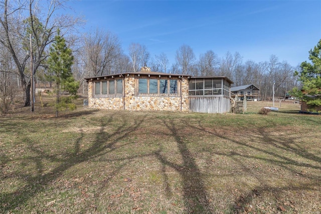 64 Trails End Ln, Doniphan, MO 63935 - view of front of home featuring a sunroom, stone siding, a front lawn, and stairs