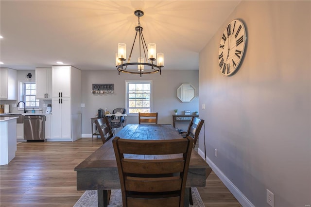 14822 Cedar Cove Pl, New London, MO 63459 - dining room featuring a chandelier, recessed lighting, healthy amount of natural light, light wood finished floors, and baseboards