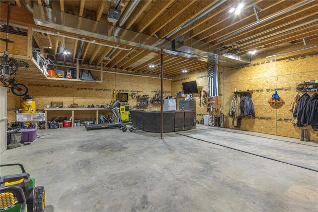 14822 Cedar Cove Pl, New London, MO 63459 - garage with a workshop area