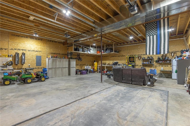 14822 Cedar Cove Pl, New London, MO 63459 - garage with a workshop area and electric panel