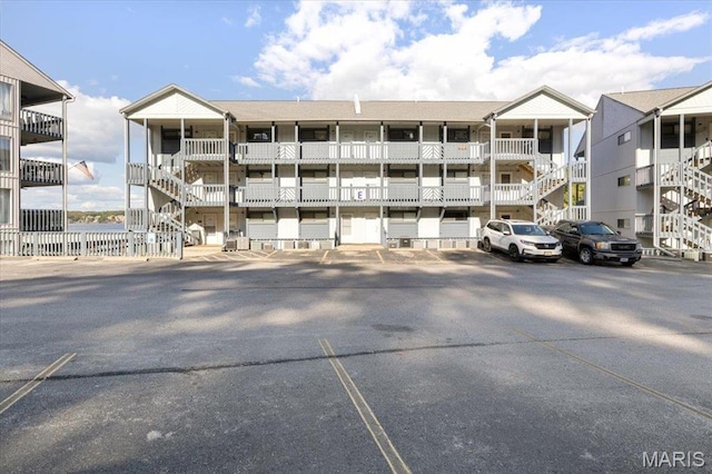 5655 Heron Bay Dr Unit E404-405, Osage Beach, MO 65065 - view of apartment building / complex with uncovered parking
