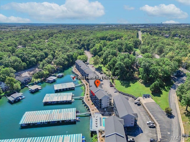 5655 Heron Bay Dr Unit E404-405, Osage Beach, MO 65065 - drone / aerial view of a forest and a nearby body of water