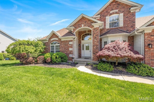 406 Clayton Hollow Dr, Wildwood, MO 63005 - traditional home featuring a front yard, brick siding, and roof with shingles