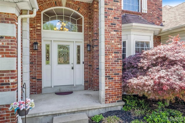 406 Clayton Hollow Dr, Wildwood, MO 63005 - doorway to property featuring brick siding and roof with shingles