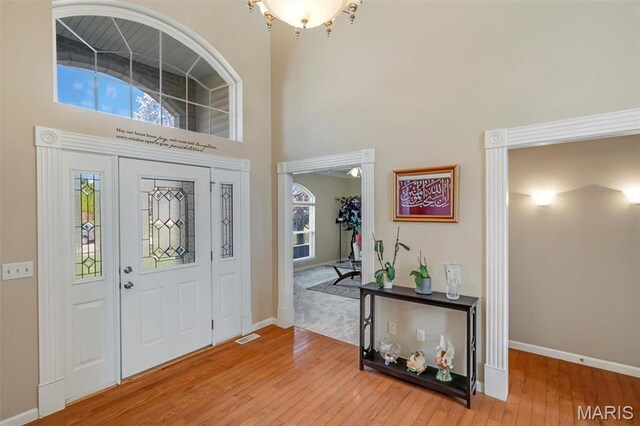406 Clayton Hollow Dr, Wildwood, MO 63005 - entryway with a towering ceiling, hardwood / wood-style flooring, and baseboards