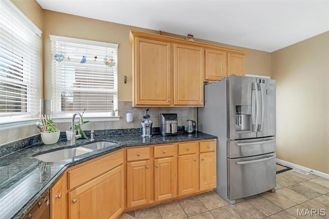 406 Clayton Hollow Dr, Wildwood, MO 63005 - kitchen featuring a sink, stainless steel fridge with ice dispenser, healthy amount of natural light, and dark stone countertops