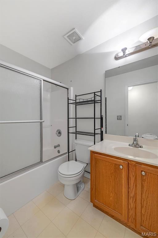 406 Clayton Hollow Dr, Wildwood, MO 63005 - bathroom with toilet, vanity, combined bath / shower with glass door, and tile patterned flooring