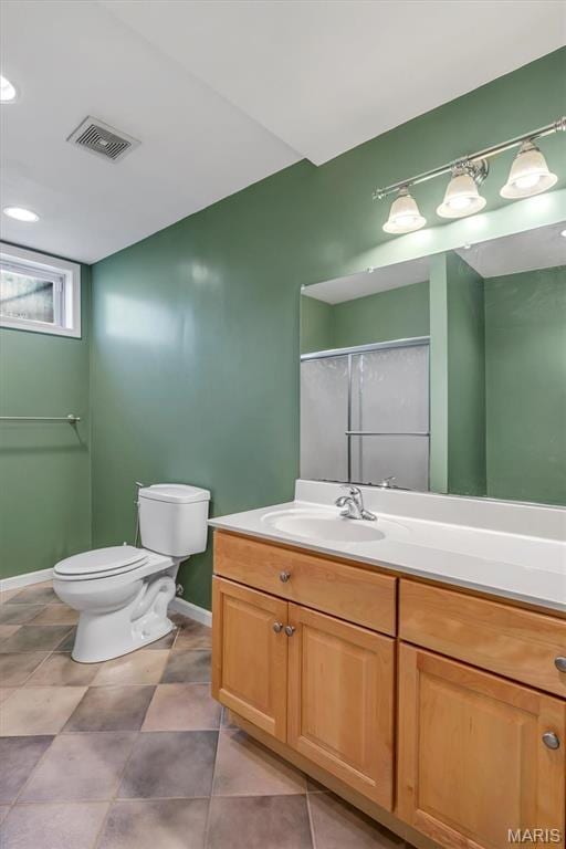 406 Clayton Hollow Dr, Wildwood, MO 63005 - bathroom featuring baseboards, vanity, toilet, and a shower with shower door