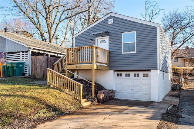 2330 Chambers Rd, Saint Louis, MO 63136 - view of front of house with an attached garage, driveway, and fence