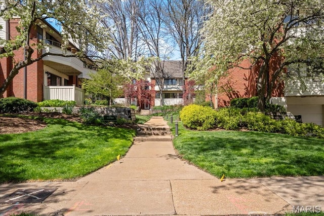 view of community featuring a yard