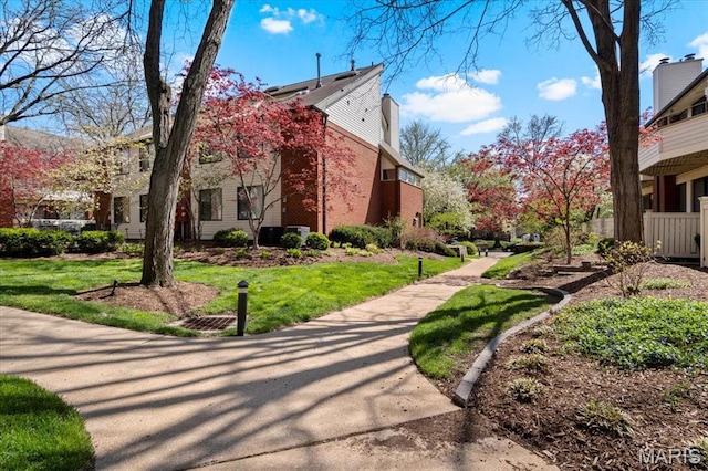 view of property's community featuring a yard