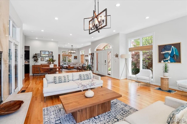 1 W Walinca, Saint Louis, MO 63105 - living area with a chandelier, recessed lighting, and light wood-style floors