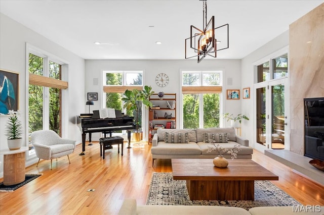 1 W Walinca, Saint Louis, MO 63105 - sitting room featuring light wood-style flooring, plenty of natural light, a chandelier, and recessed lighting