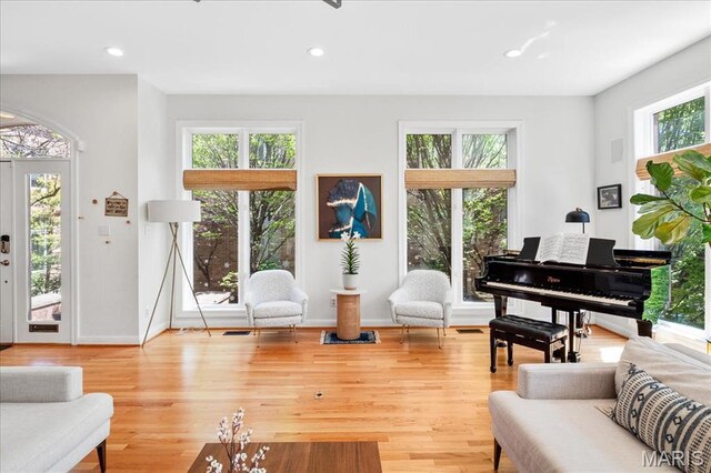 1 W Walinca, Saint Louis, MO 63105 - living area with baseboards, wood finished floors, and recessed lighting