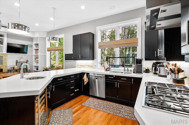 1 W Walinca, Saint Louis, MO 63105 - kitchen featuring a sink, stainless steel appliances, light countertops, and recessed lighting