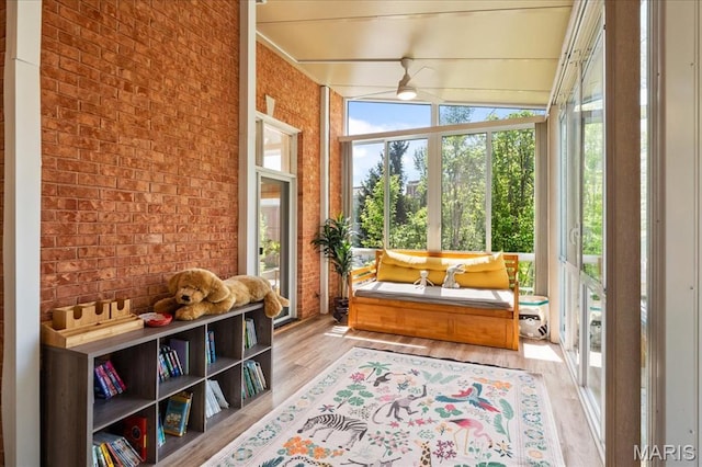 1 W Walinca, Saint Louis, MO 63105 - sunroom with plenty of natural light, wood finished floors, and brick wall