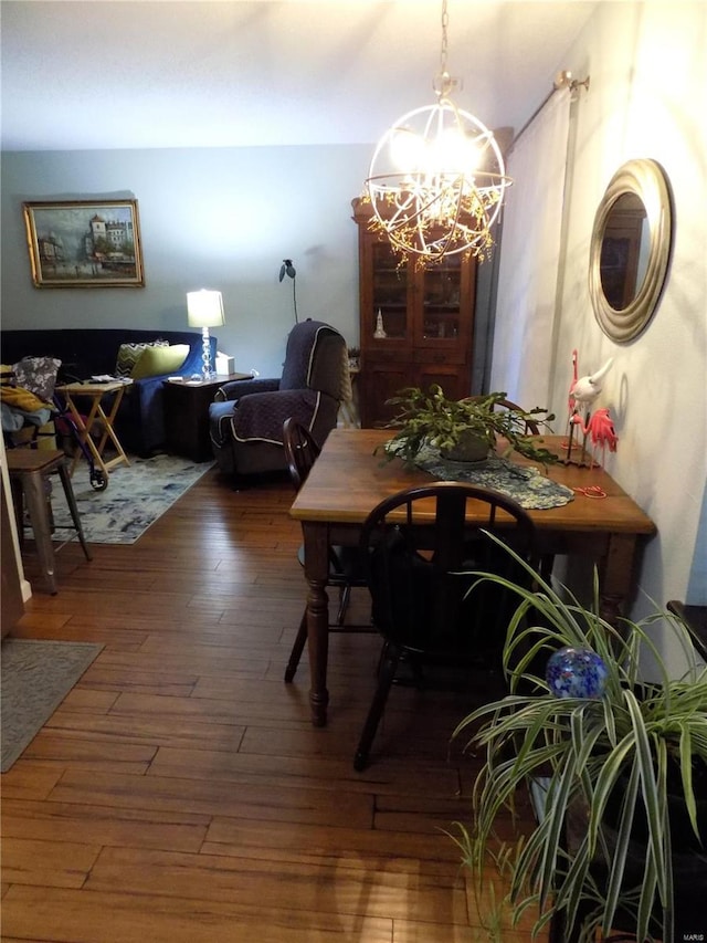 1201 Condo Dr, Rolla, MO 65401 - dining area with a chandelier and wood-type flooring