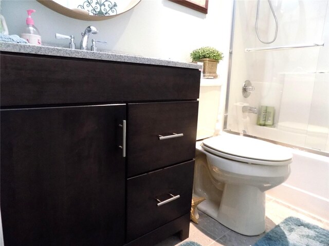 1201 Condo Dr, Rolla, MO 65401 - bathroom featuring tile patterned floors, tub / shower combination, vanity, and toilet