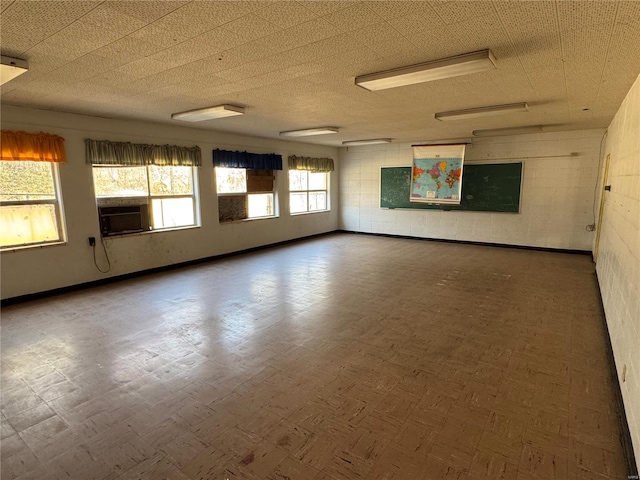 700 Charles St, Poplar Bluff, MO 63901 - empty room with cooling unit and baseboards