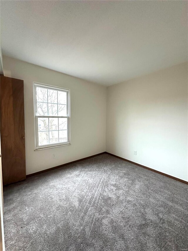1308 Condo Dr, Rolla, MO 65401 - unfurnished room featuring carpet and baseboards