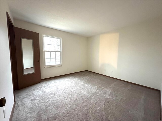 1308 Condo Dr, Rolla, MO 65401 - unfurnished room featuring carpet flooring and baseboards
