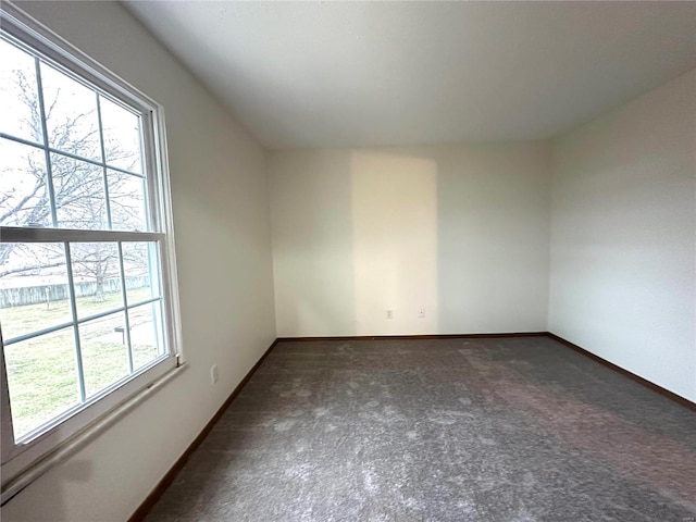 1308 Condo Dr, Rolla, MO 65401 - unfurnished room featuring dark colored carpet and baseboards