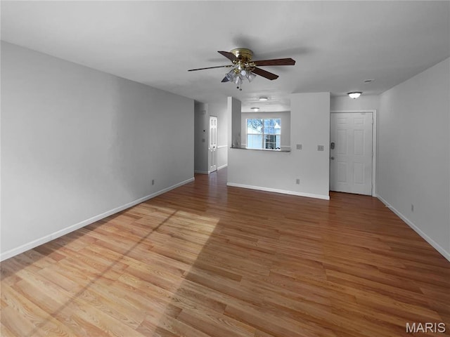 813 Sugar Valley Ct Unit 8, Saint Peters, MO 63376 - unfurnished living room with baseboards, ceiling fan, and wood finished floors