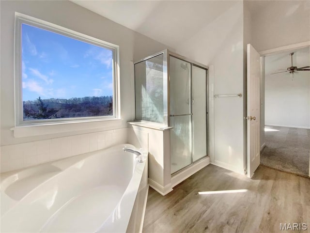878 Legends View Dr, Eureka, MO 63025 - full bathroom with wood finished floors, a bath, a shower stall, vaulted ceiling, and ceiling fan