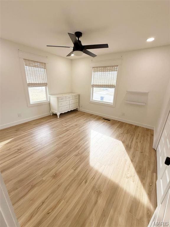 1400 S Jackson St, Salem, MO 65560 - unfurnished bedroom featuring multiple windows, baseboards, light wood-style floors, and recessed lighting